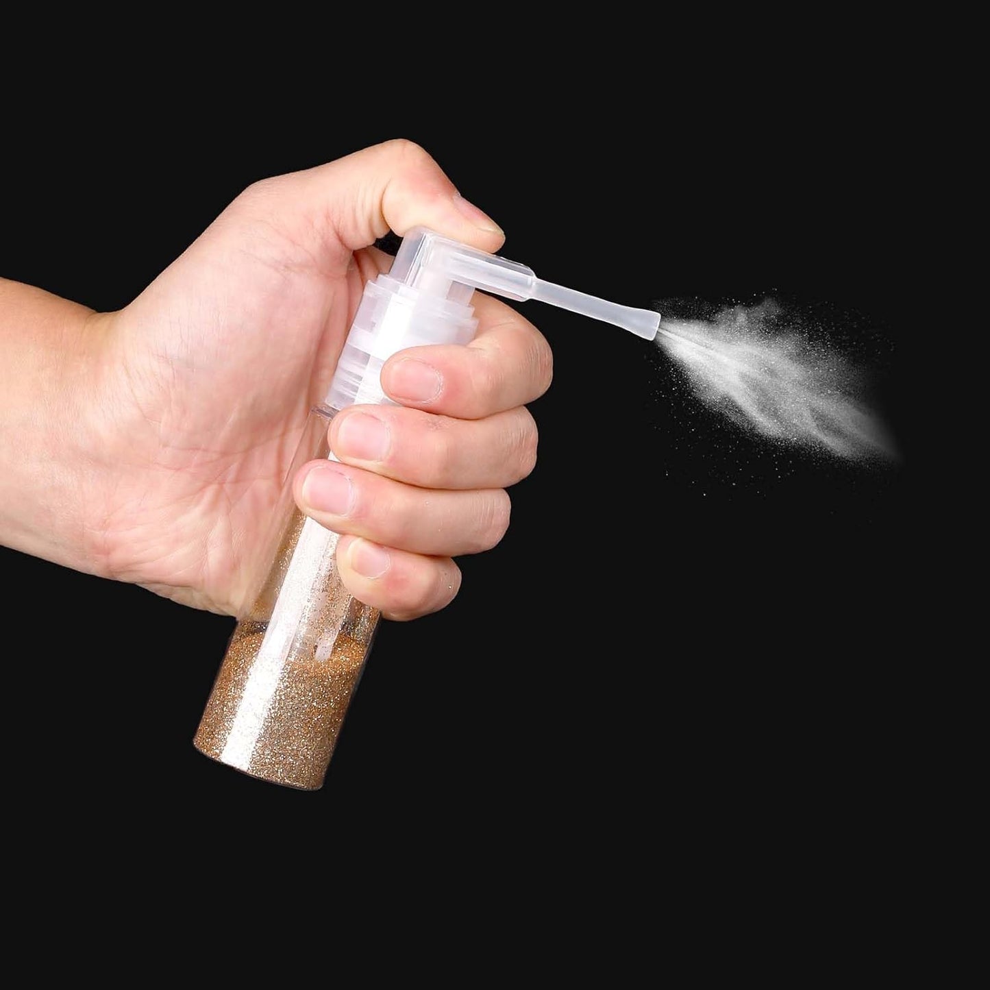 Hand holding Quivy DustMist Bottle, demonstrating precise spray for even powder application.