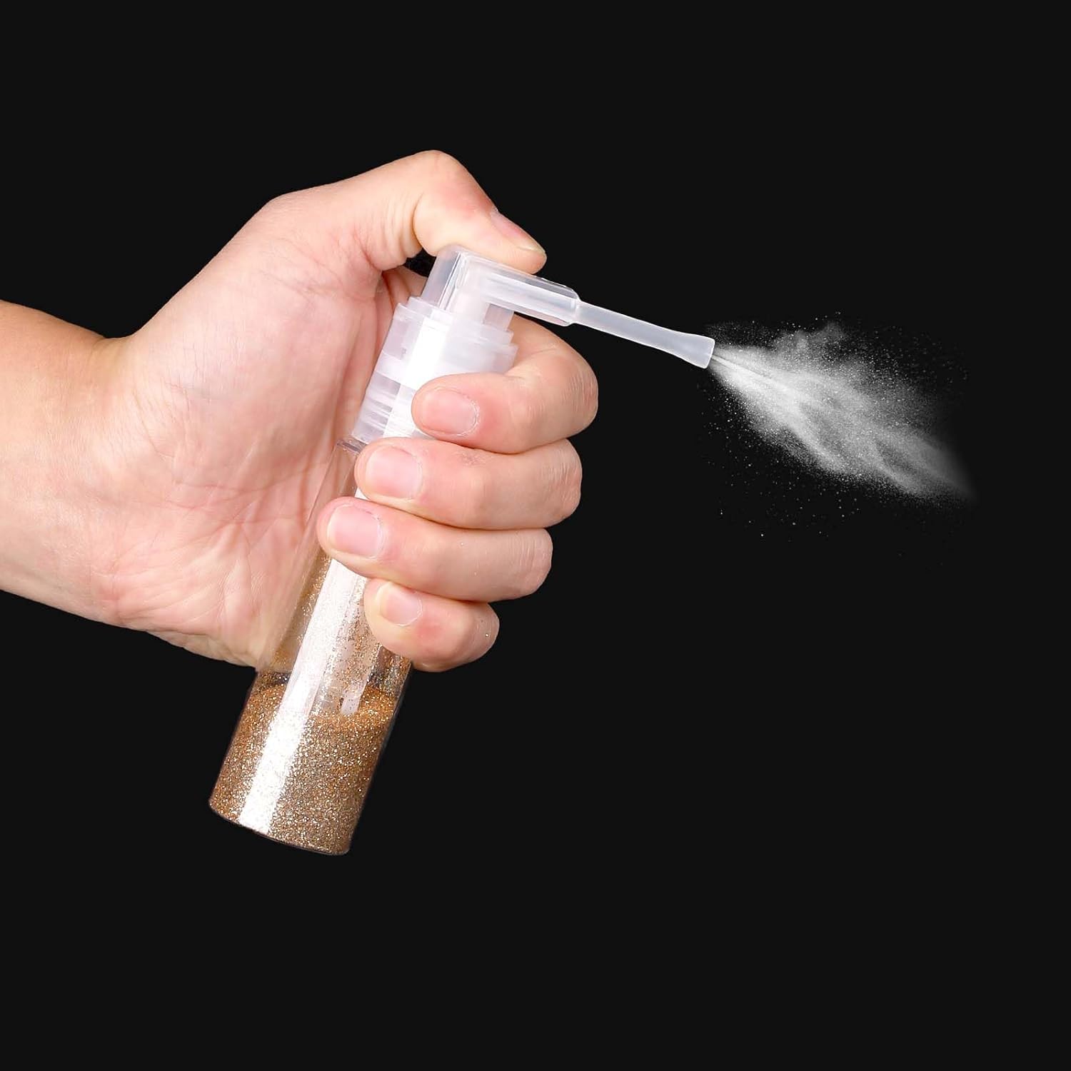 Hand holding Quivy DustMist Bottle, demonstrating precise spray for even powder application.
