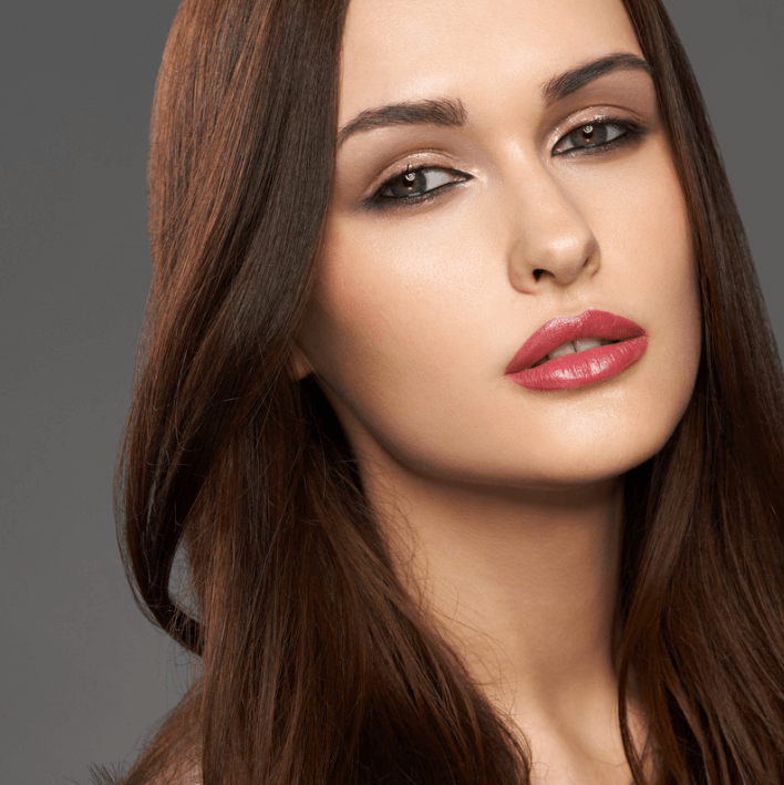 Model showcasing flawless skin and glossy lips, representing beauty with Vital Relief Gel.