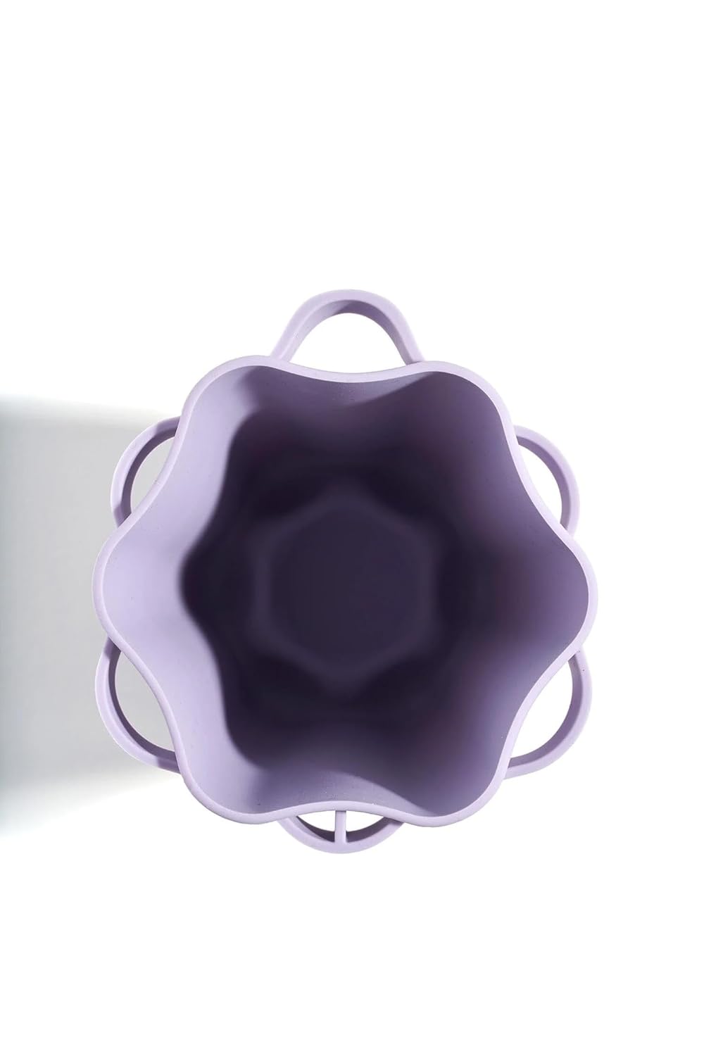 Top view of Quivy Brush Drying & Storage Cup in soft purple silicone, perfect for drying and storing makeup brushes.